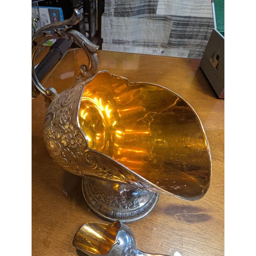vintage silver-plated sugar scuttle with a matching mini scoop